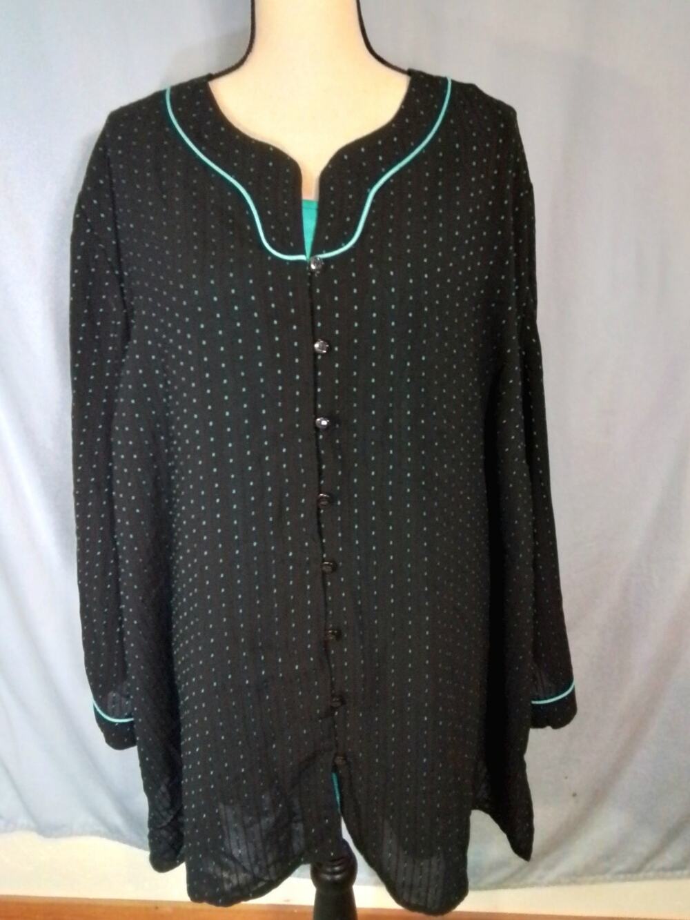 Maggie Barnes. Turquoise tank top with black and Turquoise cover-up.